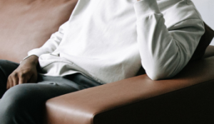man sitting on couch