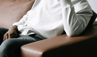 man sitting on couch