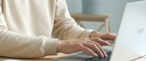 man typing on computer